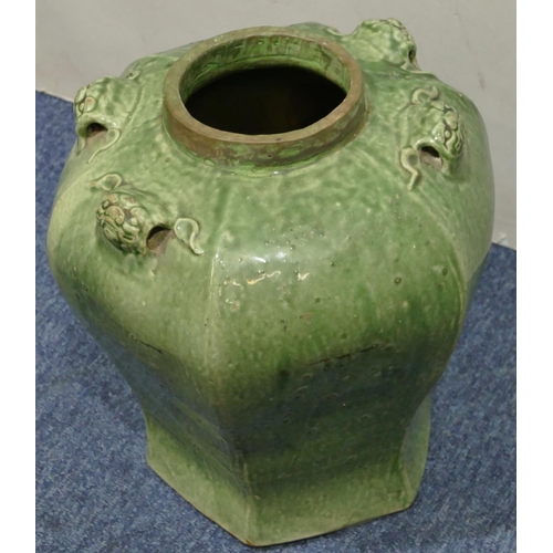 189 - A Chinese green glazed hexagonal bulbous shaped vase with raised animal head motifs, 30.5cm high.