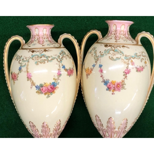 194 - A Pair Royal Crown Derby round bulbous thin necked 2 handled lidded vases on cream ground with flora... 