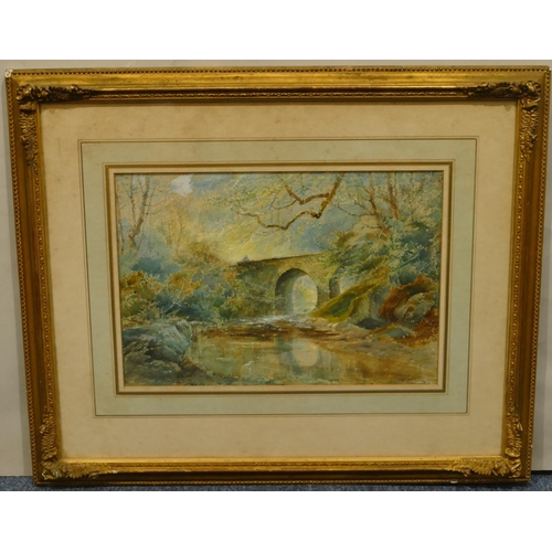 223 - A watercolour depicting woodland stream with figure on arched bridge, monogramed MA, in gilt frame, ... 