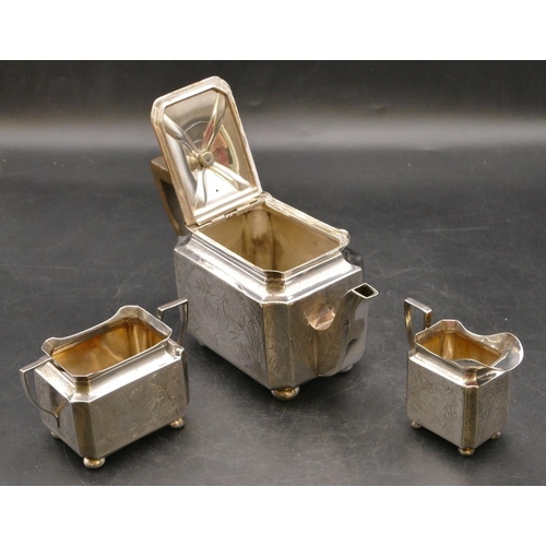 244 - A silver plated rectangular shaped 3-piece tea service with engraved bird, floral and leaf decoratio... 