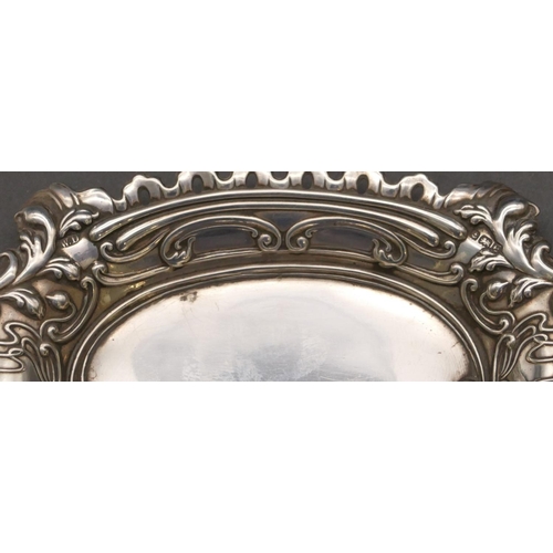 258 - A Birmingham silver scallop shaped pin dish with embossed floral and leaf decoration, 12.5cm wide, 0... 