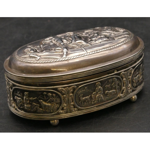 264 - A Continental oval silver coloured metal trinket box with hinged lid, allover embossed figures in bo... 