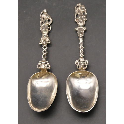 278 - A pair of 18th/19th Century Dutch silver coloured metal marriage spoons with figure motifs, pierced ... 