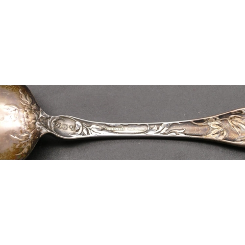 281 - A sterling silver spoon with raised leaf and scroll handle, 2.3oz