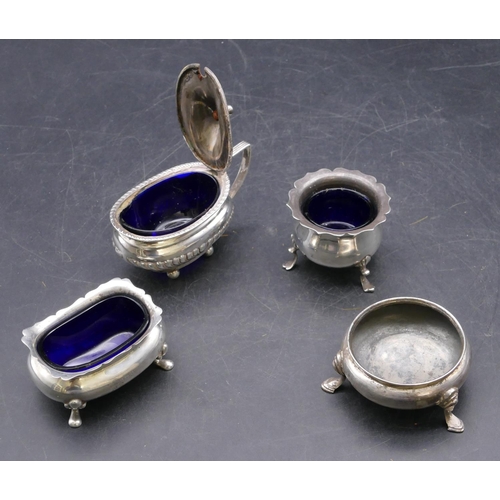 333 - A Birmingham oval silver bulbous shaped mustard pot with hinged lid and blue glass liner, part embos... 