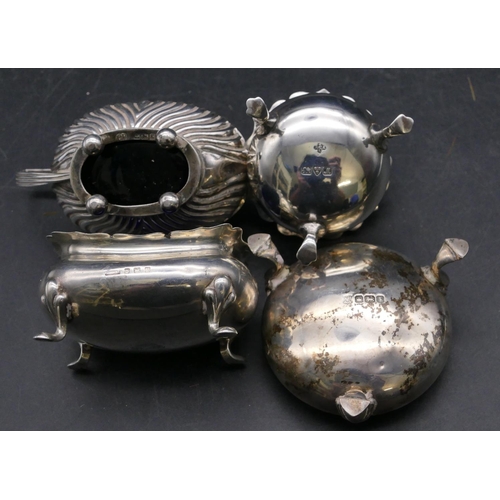 333 - A Birmingham oval silver bulbous shaped mustard pot with hinged lid and blue glass liner, part embos... 