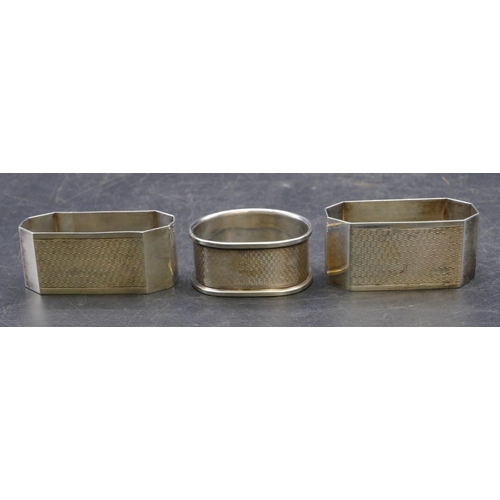 336 - A pair of Birmingham silver rectangular shaped napkin rings with chamfer corners, engraved inscripti... 