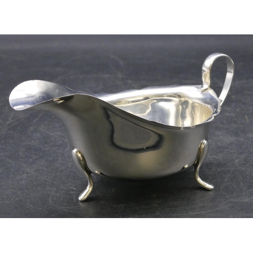 338 - A Birmingham silver sauce boat with crinkled rim on 3 splayed feet, 3oz.