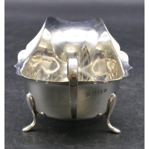 338 - A Birmingham silver sauce boat with crinkled rim on 3 splayed feet, 3oz.