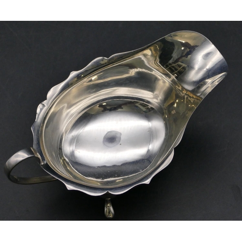 338 - A Birmingham silver sauce boat with crinkled rim on 3 splayed feet, 3oz.