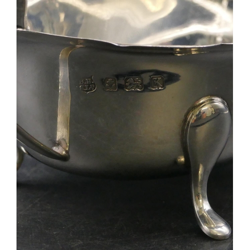 338 - A Birmingham silver sauce boat with crinkled rim on 3 splayed feet, 3oz.