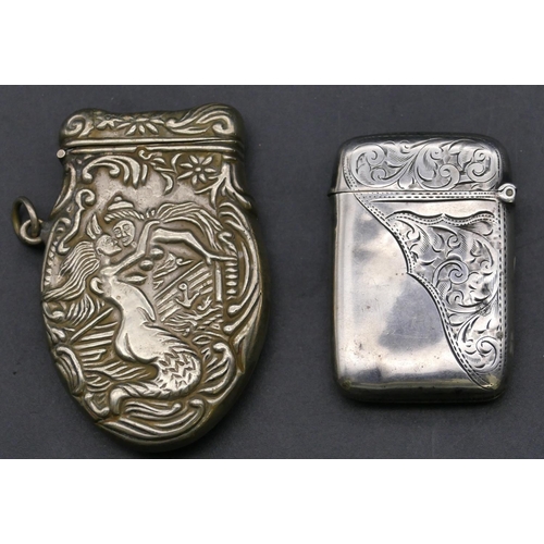 349 - A Birmingham silver vesta case with hinged lid and engraved scroll and leaf decoration and a Contine... 