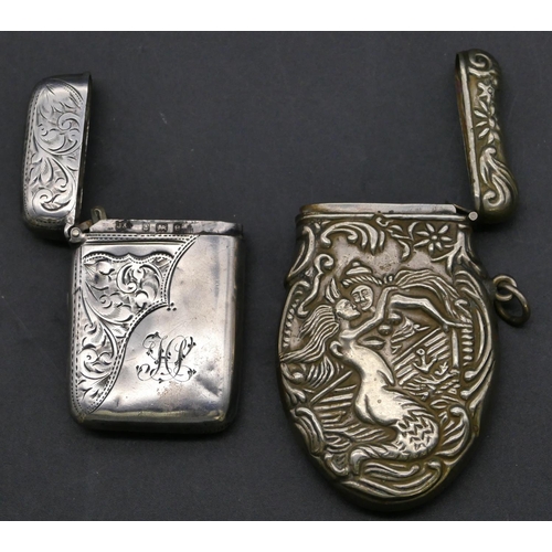 349 - A Birmingham silver vesta case with hinged lid and engraved scroll and leaf decoration and a Contine... 