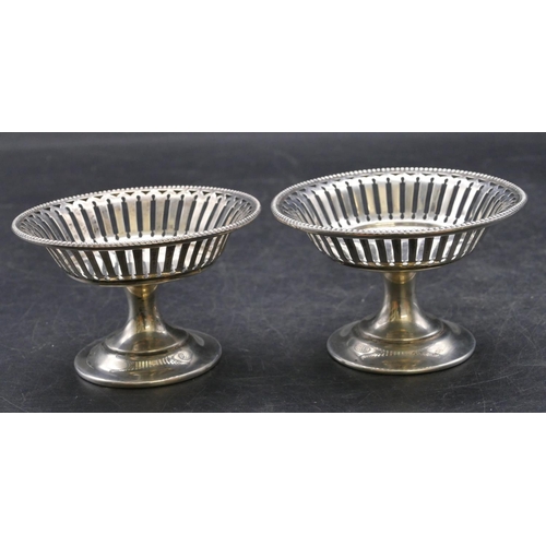 355 - A pair of Birmingham silver round sweetmeat dishes with ball and pierced rims, sweeping bases, 8.2cm... 