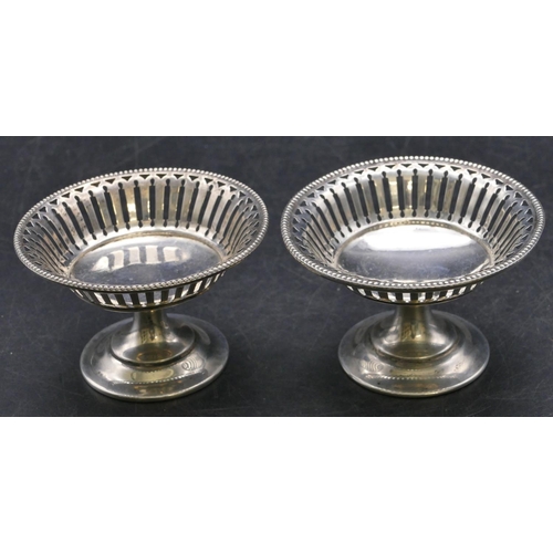 355 - A pair of Birmingham silver round sweetmeat dishes with ball and pierced rims, sweeping bases, 8.2cm... 