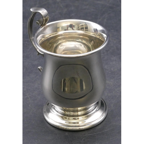 360 - A modern London silver round bulbous shaped christening mug with scroll handle on sweeping foot, 3.2... 