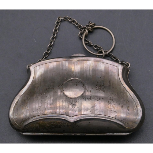 362 - A Birmingham silver bulbous shaped ladies evening purse with chain and engraved hinged front enclosi... 