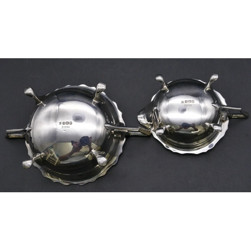 365 - A Sheffield silver round 2-handled scallop shaped sugar bowl and matching cream jug on splayed feet,... 