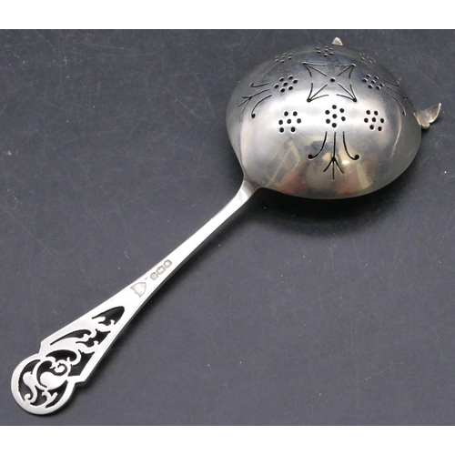 373 - A Sheffield silver tea strainer with pierced handle, 1.4oz