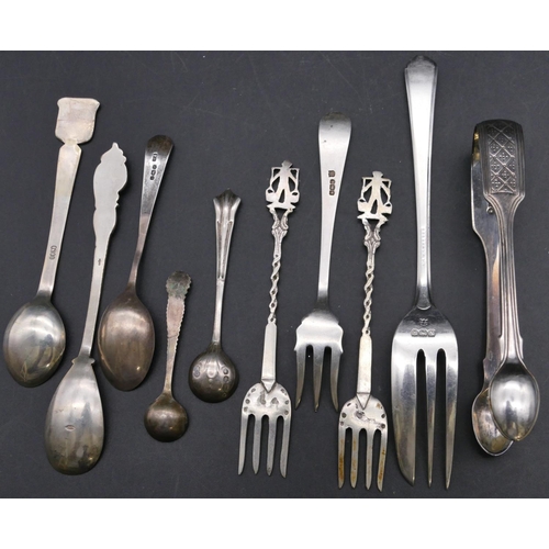 377 - A pair of Victorian silver sugar tongs, a Birmingham silver cake fork, 3 silver cake forks, 2 silver... 