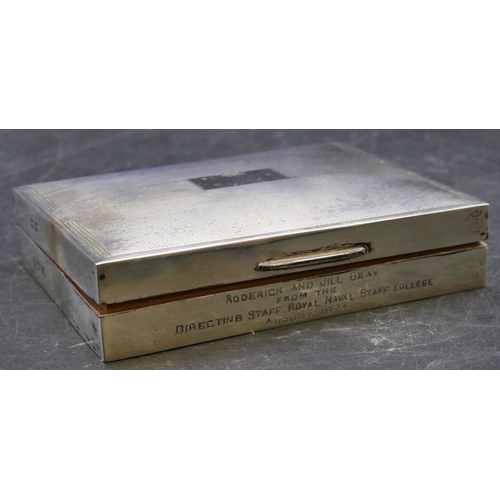 391 - A Birmingham silver shallow rectangular shaped cigarette box with engine turned hinged lid enclosing... 