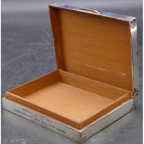 391 - A Birmingham silver shallow rectangular shaped cigarette box with engine turned hinged lid enclosing... 