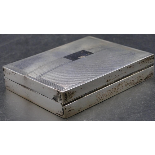 391 - A Birmingham silver shallow rectangular shaped cigarette box with engine turned hinged lid enclosing... 