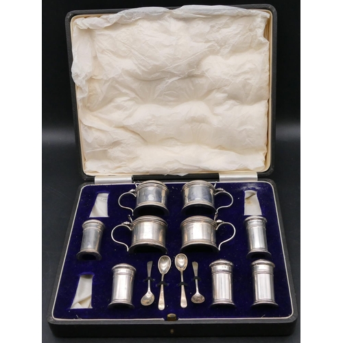 393 - A Birmingham silver large condiment set comprising of 4 mustard pots, 3 pepper pots, all with blue g... 