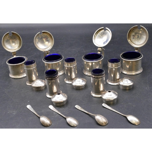 393 - A Birmingham silver large condiment set comprising of 4 mustard pots, 3 pepper pots, all with blue g... 