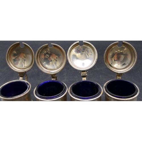 393 - A Birmingham silver large condiment set comprising of 4 mustard pots, 3 pepper pots, all with blue g... 