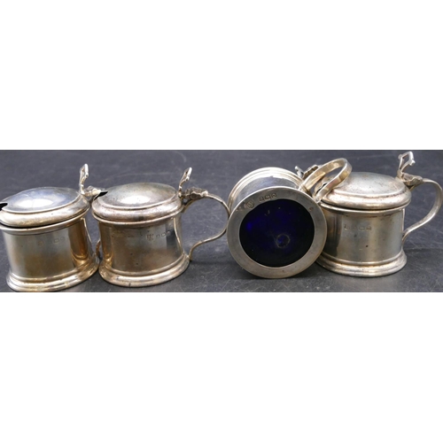 393 - A Birmingham silver large condiment set comprising of 4 mustard pots, 3 pepper pots, all with blue g... 