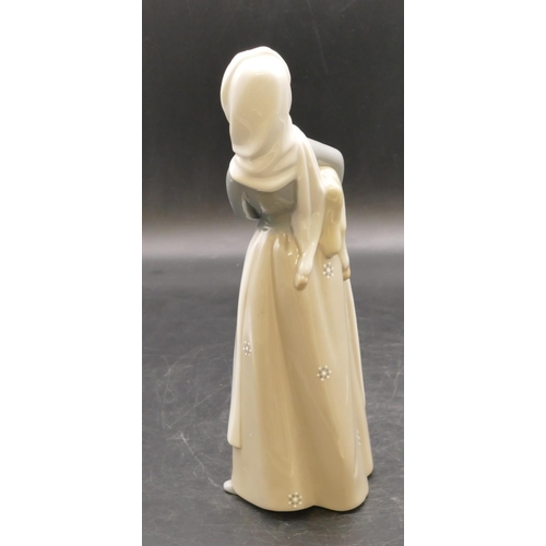 4 - A Lladro figure of a standing lady holding a lamb, 26.5cm high