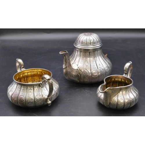 405 - A Garrard's Victorian silver 3-piece round bulbous shaped tea service with allover engraved decorati... 