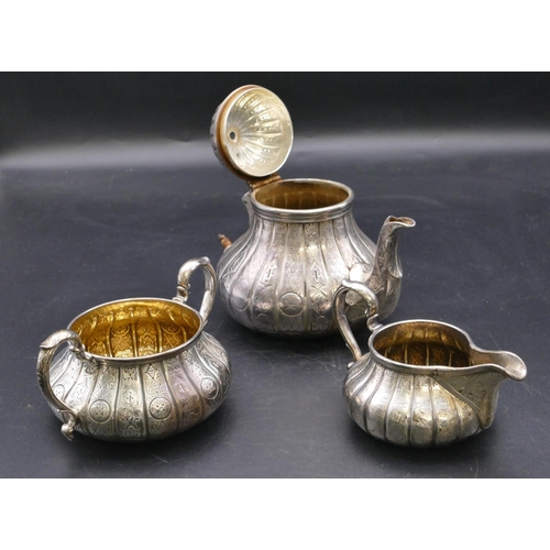 405 - A Garrard's Victorian silver 3-piece round bulbous shaped tea service with allover engraved decorati... 