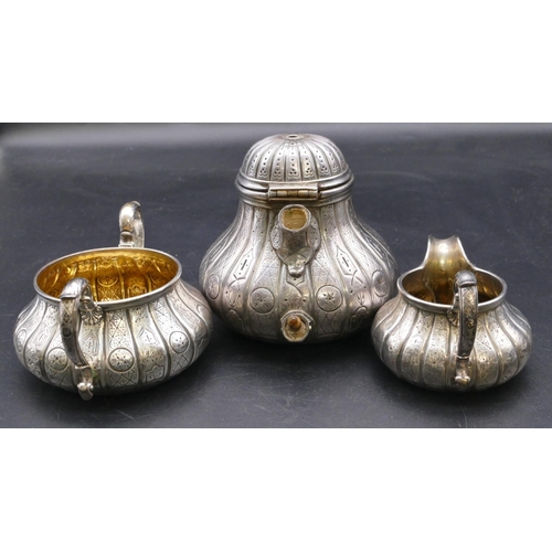 405 - A Garrard's Victorian silver 3-piece round bulbous shaped tea service with allover engraved decorati... 