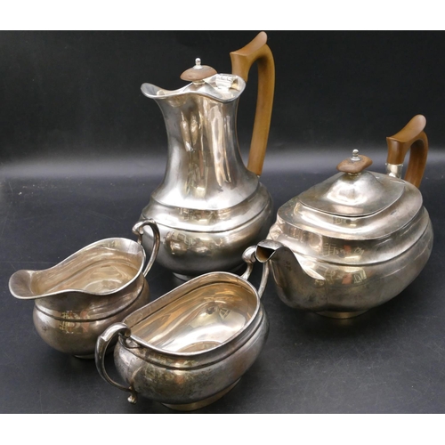 408 - A 4-piece George V silver rectangular bulbous shaped tea service comprising teapot and hot water jug... 