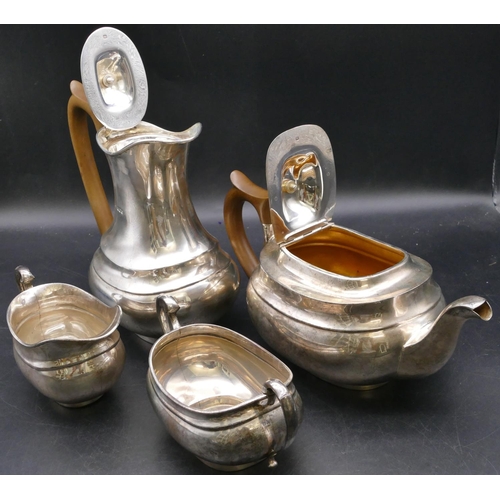 408 - A 4-piece George V silver rectangular bulbous shaped tea service comprising teapot and hot water jug... 