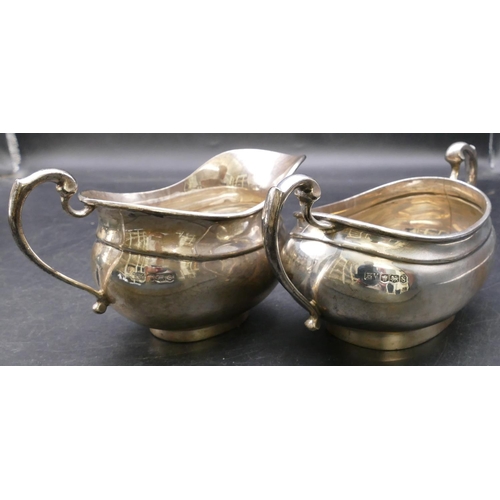 408 - A 4-piece George V silver rectangular bulbous shaped tea service comprising teapot and hot water jug... 