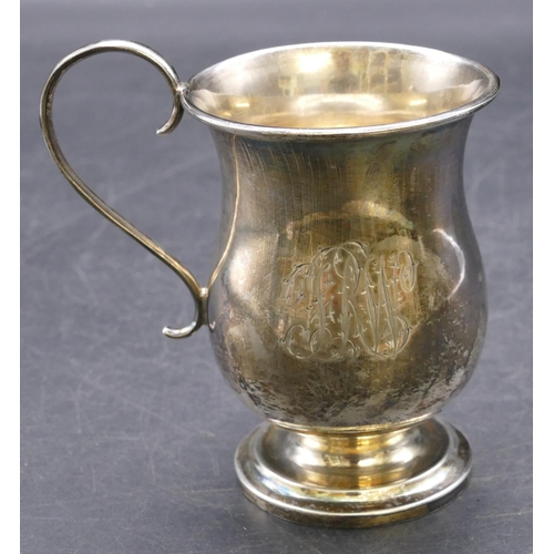 415 - A Sheffield silver round bulbous shaped christening mug with scroll handle, sweeping foot with engra... 