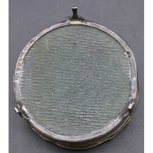 433 - A Birmingham silver round trinket box with scallop shaped hinged lid enclosing green velvet interior... 