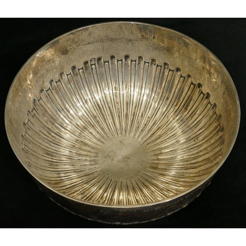 436 - An Edward VII silver round punch bowl with part embossed reeded decoration on sweeping foot, London ... 