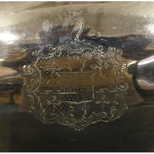 439 - An oval silver plated meat cover with centre carrying handle with engraved crest, 36cm diameter