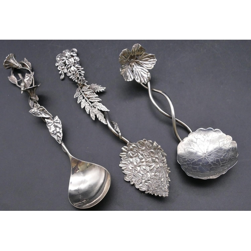 450 - A London silver spoon with raised branch shaped handle and embossed bowl, a similar London silver sp... 