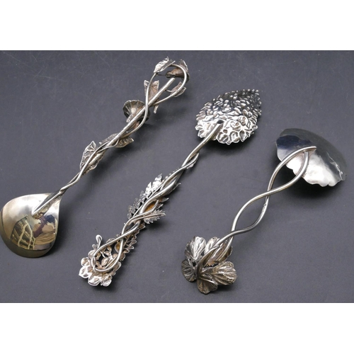 450 - A London silver spoon with raised branch shaped handle and embossed bowl, a similar London silver sp... 