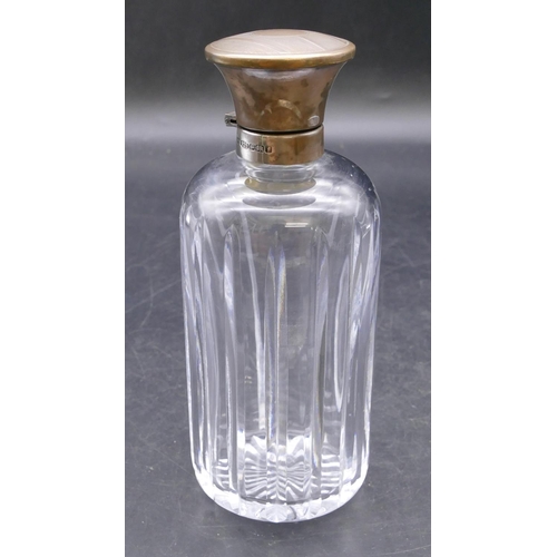 459 - A heavy cut glass round bulbous shaped scent bottle with Birmingham silver neck and hinged lid enclo... 