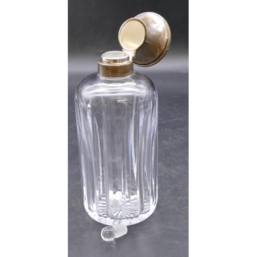 459 - A heavy cut glass round bulbous shaped scent bottle with Birmingham silver neck and hinged lid enclo... 