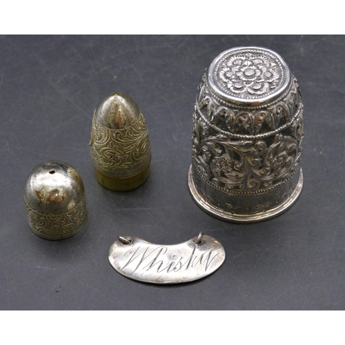 462 - An Edward VII small silver Whisky label with chain, a small thimble shaped shot glass with embossed ... 