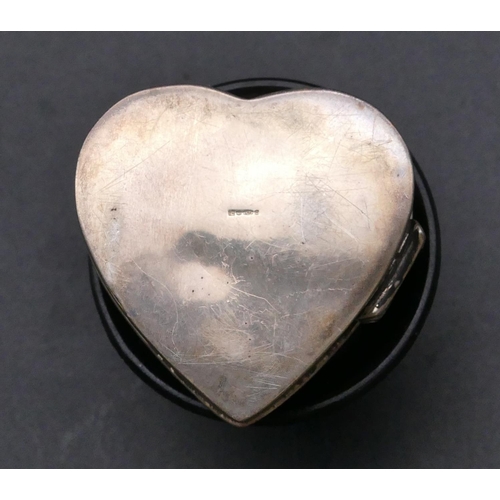 463 - A 925 small oval silver pill box with hinged lid depicting 2 birds, a 925 silver heart shaped pill b... 