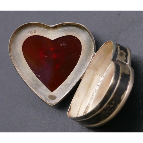 463 - A 925 small oval silver pill box with hinged lid depicting 2 birds, a 925 silver heart shaped pill b... 