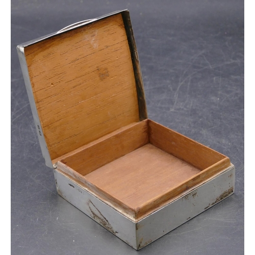 473 - A Birmingham square silver cigarette box with engine turned hinged lid enclosing cedar lined interio... 